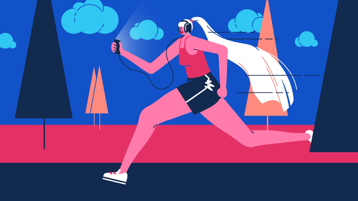 mixkit woman running while wearing headphones and holding a mobile phone 63 original large.jpg